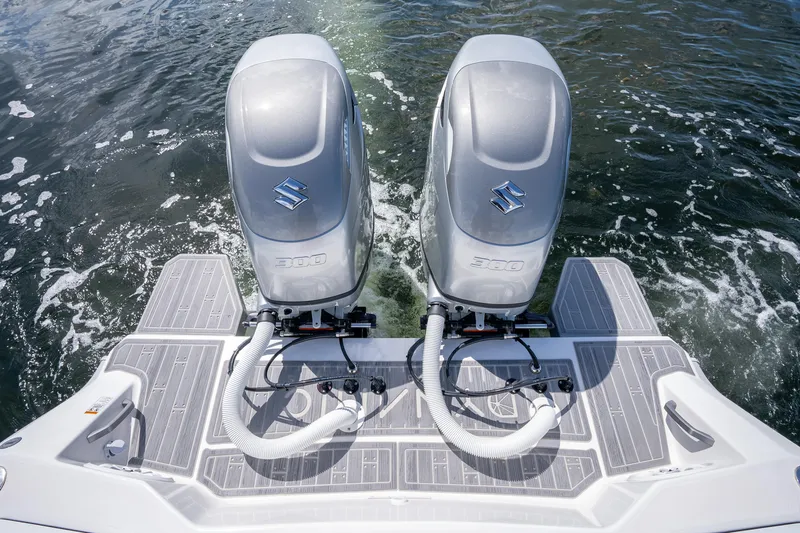  Yacht Photos Pics Twin outboard motors on a Dynamic D-305V boat, 2023 model, in water.