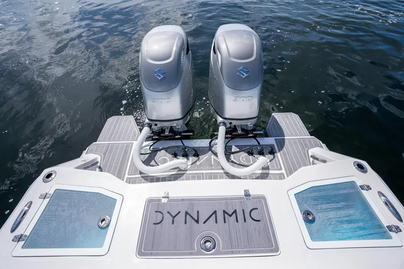 Yacht Photos Pics 2023 Dynamic D-305V boat with dual Suzuki outboard motors on water.
