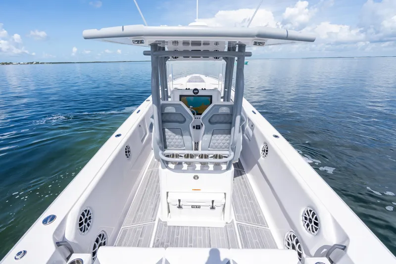  Yacht Photos Pics 2023 Dynamic D-305V boat on calm water, featuring sleek design and modern controls.