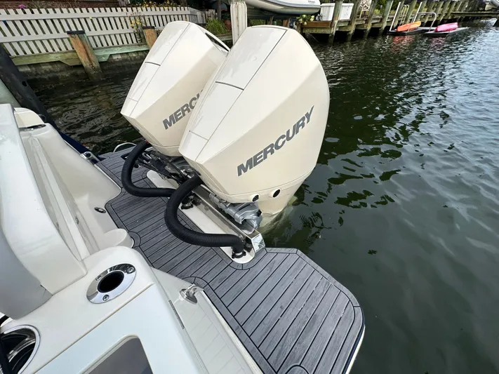  Yacht Photos Pics 2024 Scout 277 LXF with Mercury engines at dock.