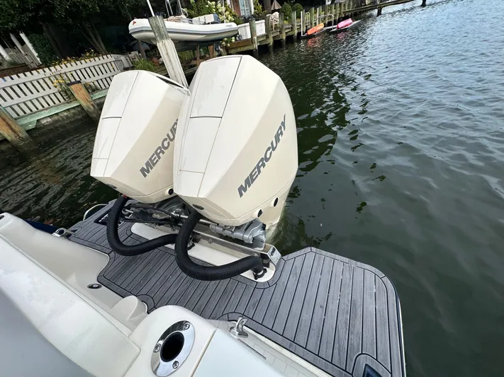  Yacht Photos Pics 2024 Scout 277 LXF with Mercury engines at dock.