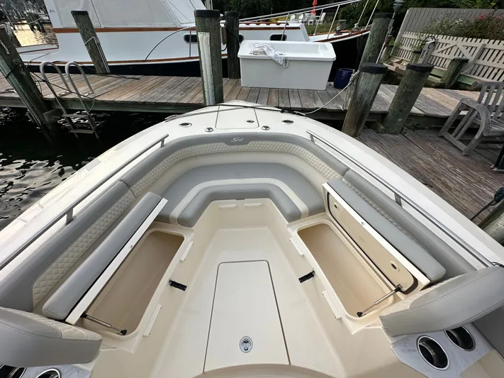  Yacht Photos Pics Interior view of 2024 Scout 277 LXF boat with seating and storage.