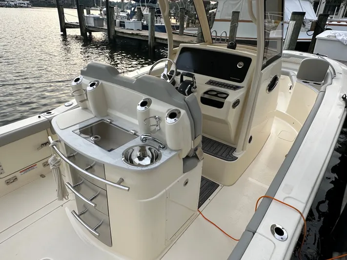  Yacht Photos Pics 2024 Scout 277 LXF boat with modern helm and sink.
