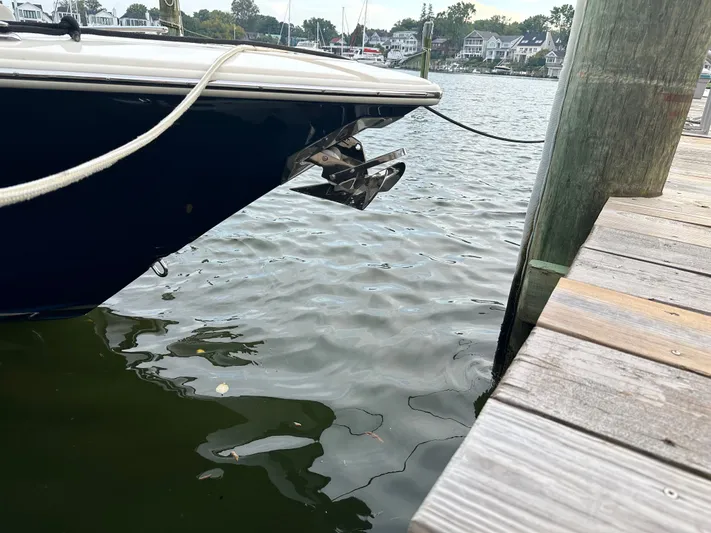  Yacht Photos Pics 2024 Scout 277 LXF boat docked by wooden pier.