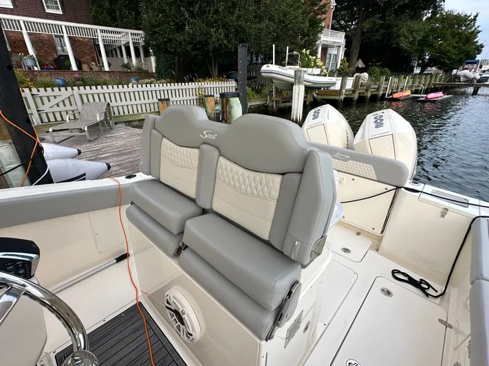  Yacht Photos Pics 2024 Scout 277 LXF boat with luxurious seating at the dock.