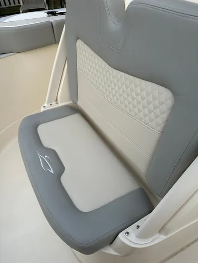  Yacht Photos Pics 2024 Scout 277 LXF boat seat with gray and cream upholstery.