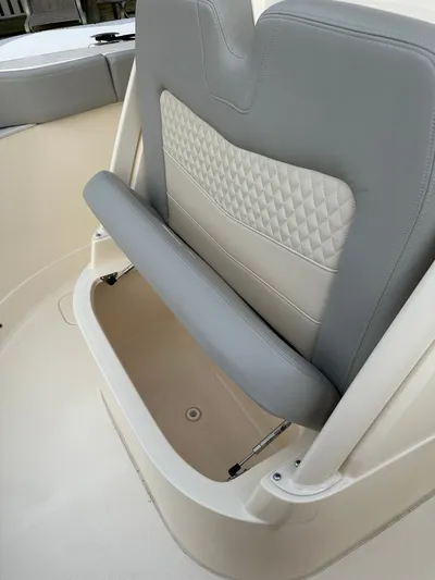  Yacht Photos Pics 2024 Scout 277 LXF boat seat with storage compartment.