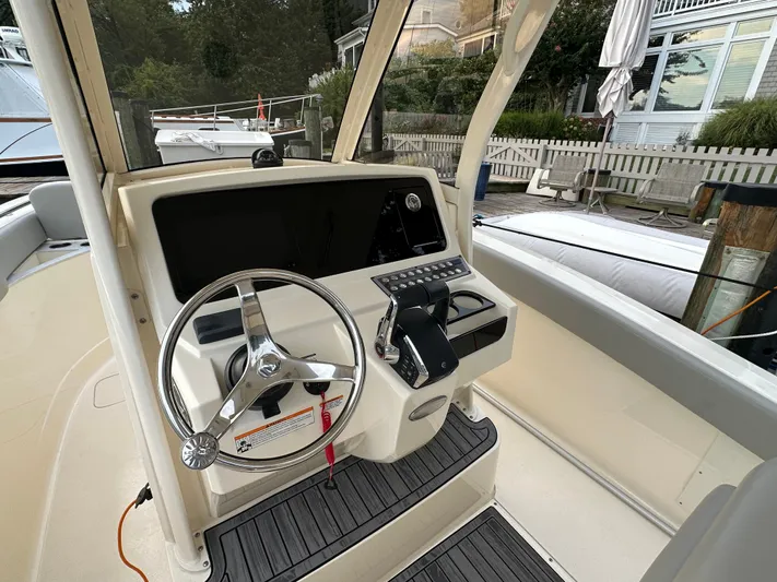  Yacht Photos Pics Helm of 2024 Scout 277 LXF boat docked at marina.