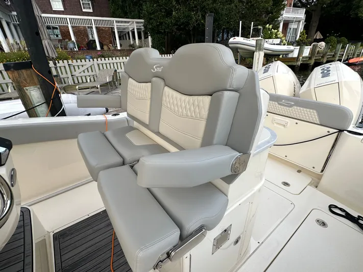  Yacht Photos Pics 2024 Scout 277 LXF boat seat with luxurious design.