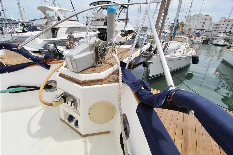  Yacht Photos Pics 1989 Grand Banks Classic yacht deck with winch, docked in marina.