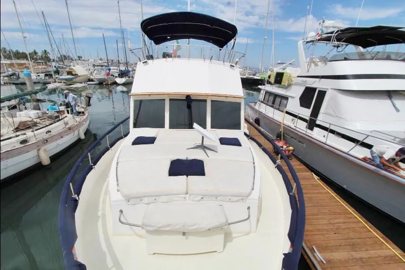  Yacht Photos Pics 1989 Grand Banks Classic yacht docked in a marina, surrounded by other boats.