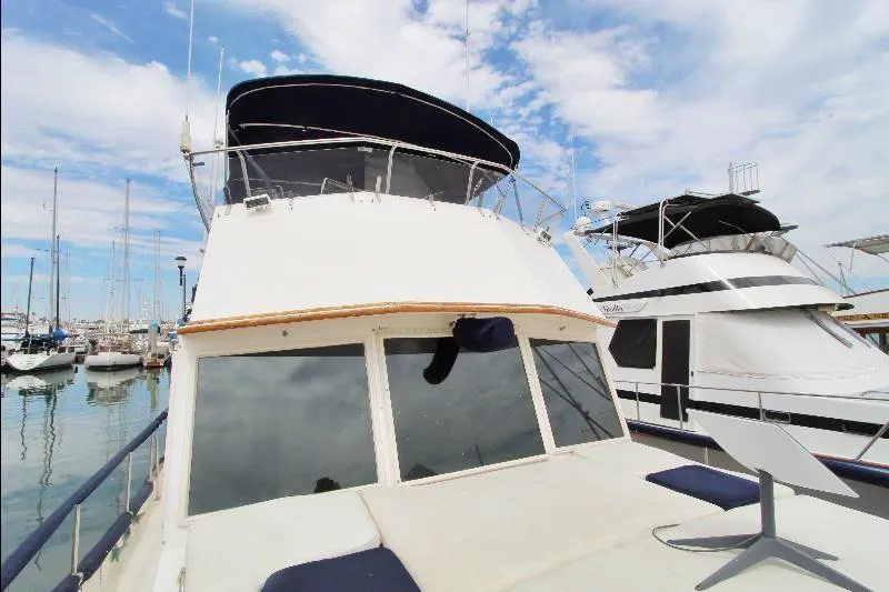  Yacht Photos Pics 1989 Grand Banks Classic yacht docked at marina under blue sky.