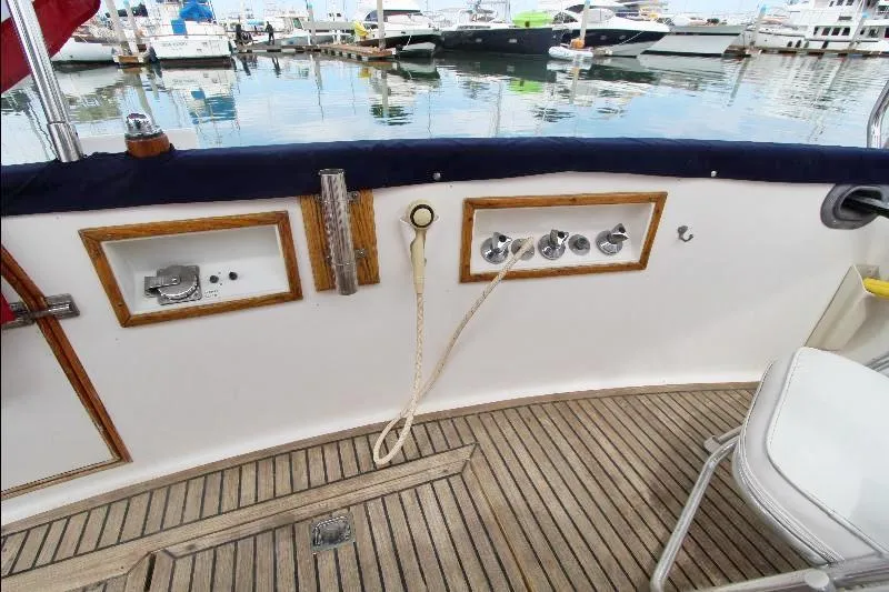  Yacht Photos Pics 1989 Grand Banks Classic yacht deck with wooden flooring and marina view.