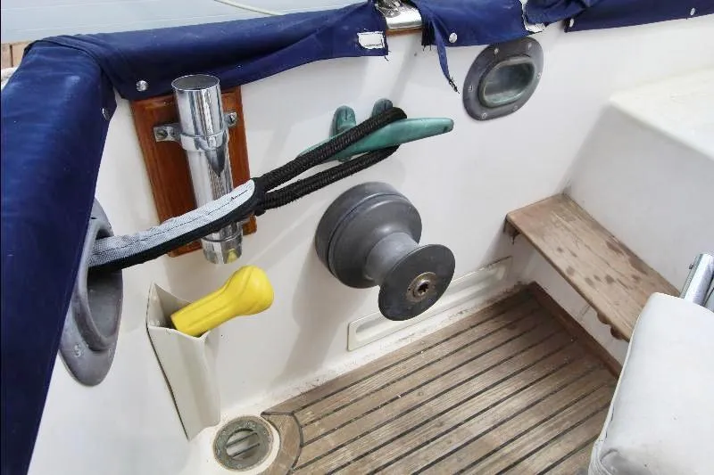  Yacht Photos Pics 1989 Grand Banks Classic boat deck with winch, ropes, and wooden flooring.