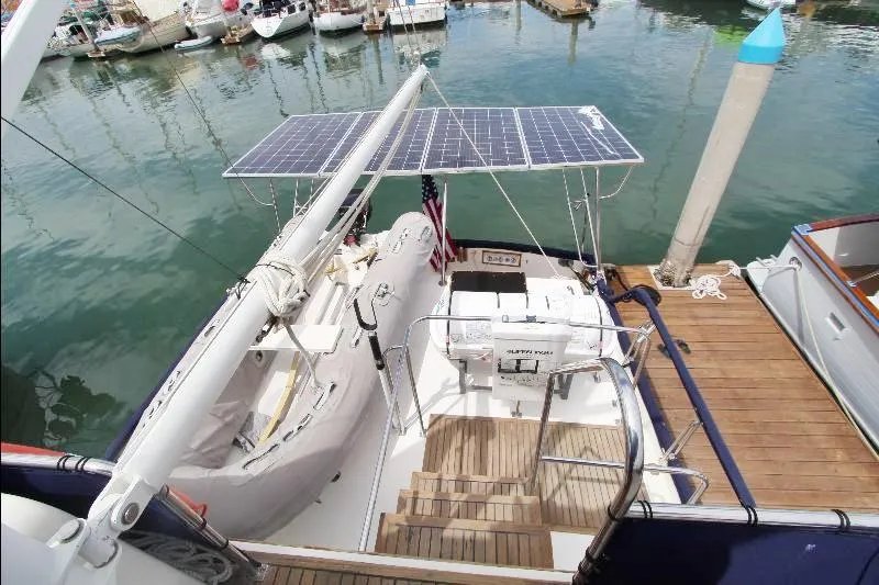  Yacht Photos Pics 1989 Grand Banks Classic yacht with solar panels docked at marina.