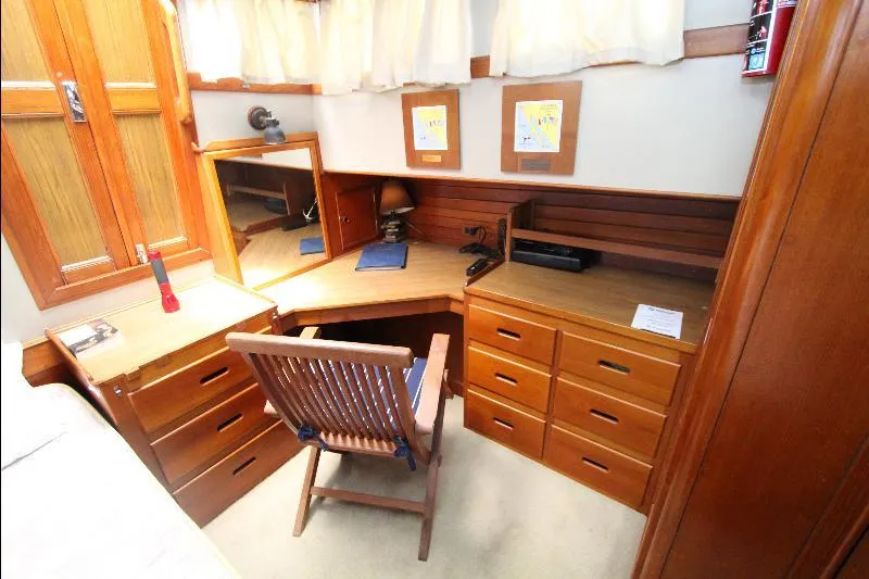  Yacht Photos Pics 1989 Grand Banks Classic yacht interior with wooden desk and drawers.