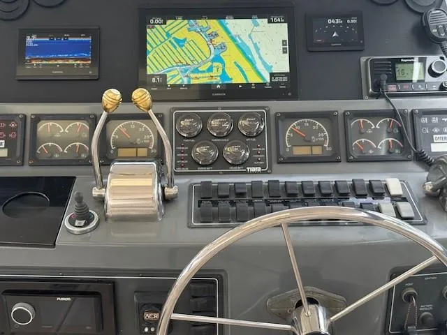 Shelly Anne Yacht Photos Pics Control panel of a 2000 Tiara Yachts 5200 Express with navigation and engine gauges.
