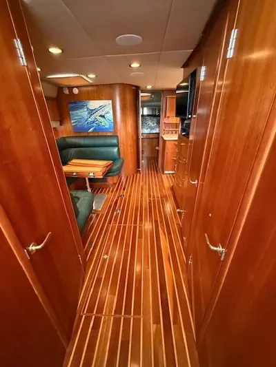 Shelly Anne Yacht Photos Pics Interior of 2000 Tiara Yachts 5200 Express, featuring wood paneling and elegant seating area.