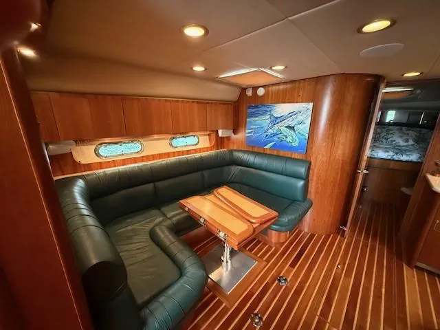 Shelly Anne Yacht Photos Pics Luxurious 2000 Tiara Yachts 5200 Express interior with leather seating and wooden accents.