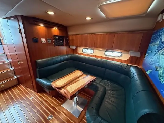 Shelly Anne Yacht Photos Pics Luxurious interior of 2000 Tiara Yachts 5200 Express with leather seating and wooden accents.