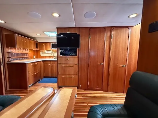 Shelly Anne Yacht Photos Pics Luxurious interior of 2000 Tiara Yachts 5200 Express with wood finishes and modern amenities.