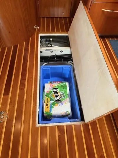 Shelly Anne Yacht Photos Pics Storage compartment on 2000 Tiara Yachts 5200 Express with paper towels and equipment.