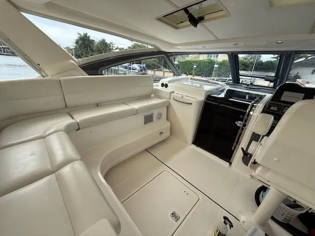 Shelly Anne Yacht Photos Pics Interior of 2000 Tiara Yachts 5200 Express, featuring sleek white seating and modern controls.