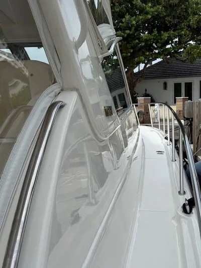 Shelly Anne Yacht Photos Pics 2000 Tiara Yachts 5200 Express, sleek white exterior with polished railings.