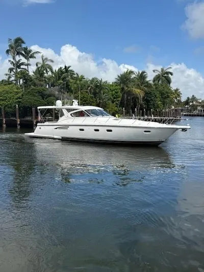 Shelly Anne Yacht Photos Pics 2000 Tiara Yachts 5200 Express cruising on a calm, scenic waterway.