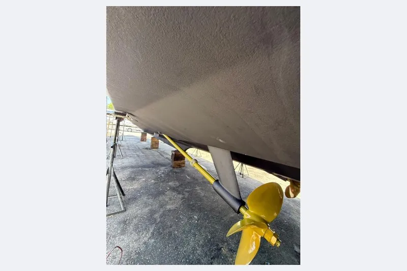 Shelly Anne Yacht Photos Pics Underside view of 2000 Tiara Yachts 5200 Express with yellow propeller.