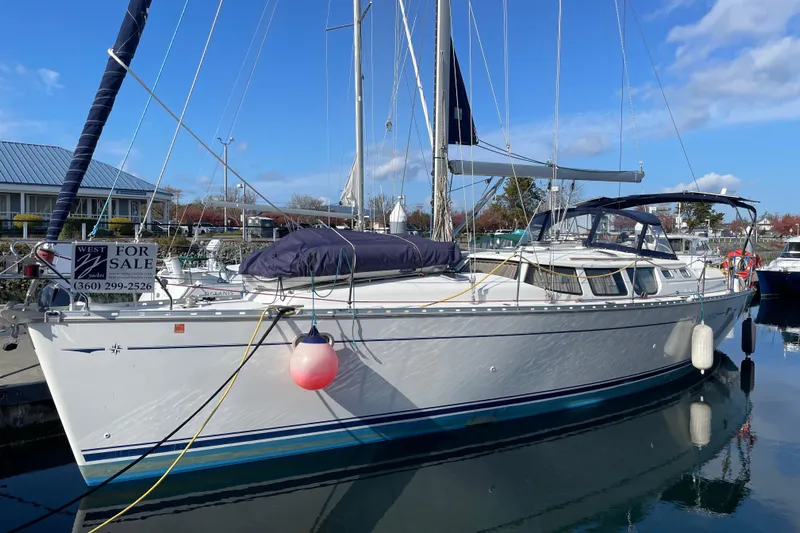 "dragonfly" Yacht Photos Pics 2003 Jeanneau Sun Odyssey 43 DS sailboat docked, for sale, with clear blue sky.