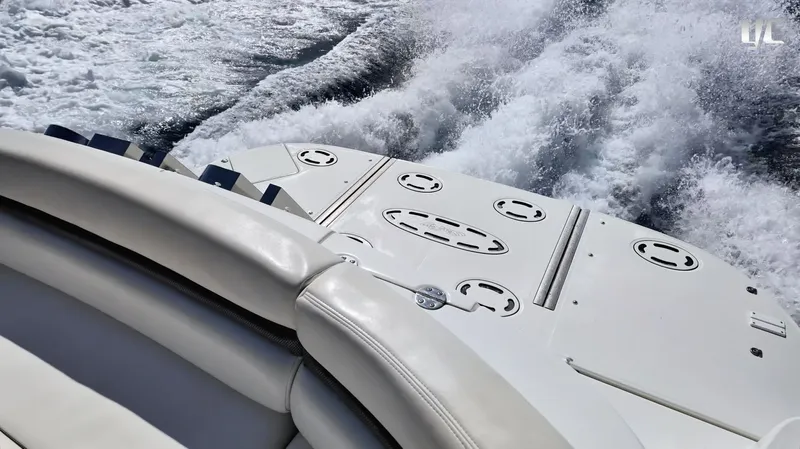  Yacht Photos Pics 2006 Sea Ray 52 Sundancer cruising, showing wake and sleek deck design.