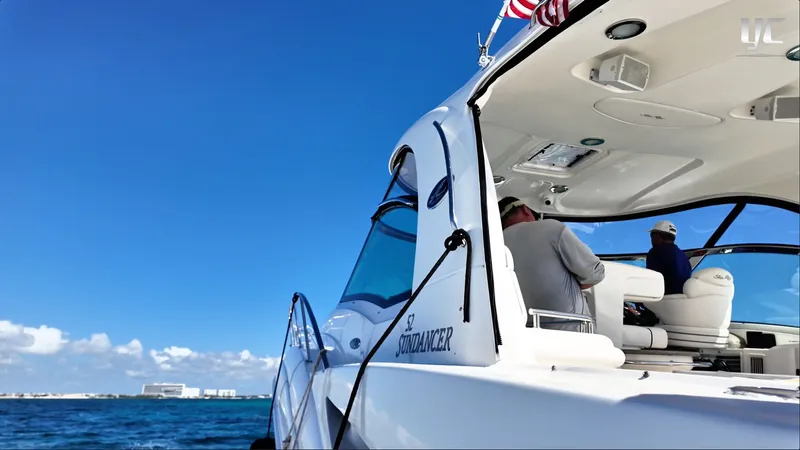  Yacht Photos Pics 2006 Sea Ray 52 Sundancer yacht cruising on a sunny day with clear blue skies.