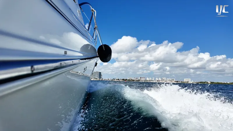  Yacht Photos Pics 2006 Sea Ray 52 Sundancer cruising on open water under a clear blue sky.