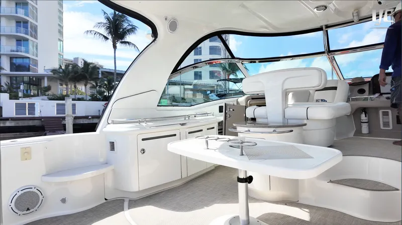  Yacht Photos Pics Interior view of a 2006 Sea Ray 52 Sundancer yacht with modern seating and table.