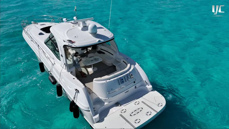  Yacht Photos Pics 2006 Sea Ray 52 Sundancer yacht on clear turquoise water, aerial view.