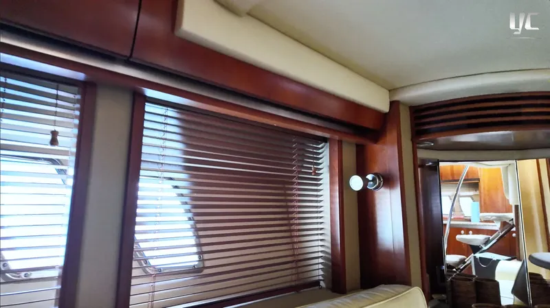  Yacht Photos Pics Interior of 2006 Sea Ray 52 Sundancer yacht with wooden blinds and modern furnishings.