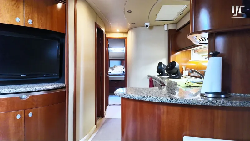  Yacht Photos Pics Luxurious interior of 2006 Sea Ray 52 Sundancer yacht with wood finishes and modern amenities.