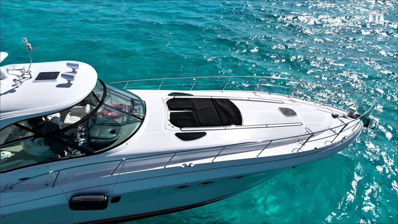  Yacht Photos Pics 2006 Sea Ray 52 Sundancer yacht cruising on clear turquoise waters.