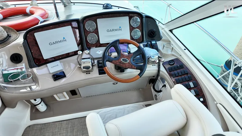  Yacht Photos Pics 2006 Sea Ray 52 Sundancer helm with Garmin navigation displays and luxurious steering wheel.