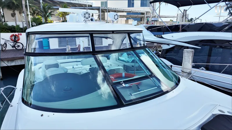  Yacht Photos Pics 2006 Sea Ray 52 Sundancer yacht docked at marina, showcasing sleek design and spacious interior.