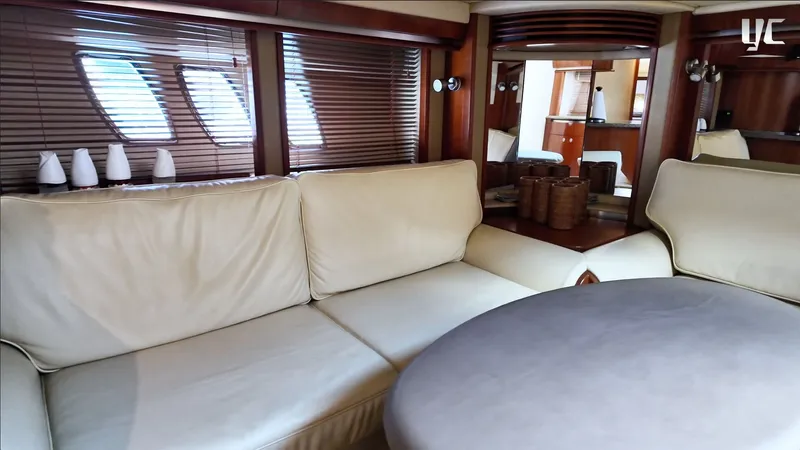  Yacht Photos Pics Luxurious interior of 2006 Sea Ray 52 Sundancer yacht with plush seating and elegant decor.