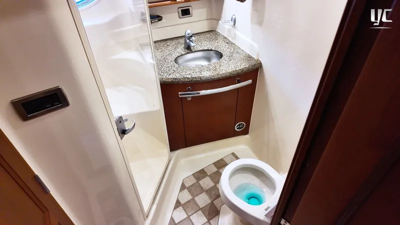  Yacht Photos Pics Bathroom interior of 2006 Sea Ray 52 Sundancer yacht with granite countertop and toilet.