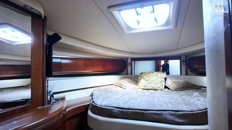  Yacht Photos Pics Luxurious cabin interior of 2006 Sea Ray 52 Sundancer yacht with skylight and plush bedding.