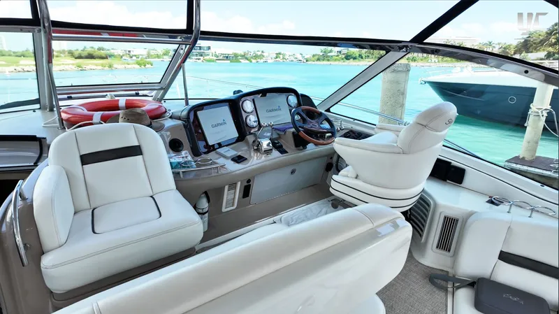  Yacht Photos Pics Luxurious 2006 Sea Ray 52 Sundancer yacht interior with modern navigation equipment and plush seating.