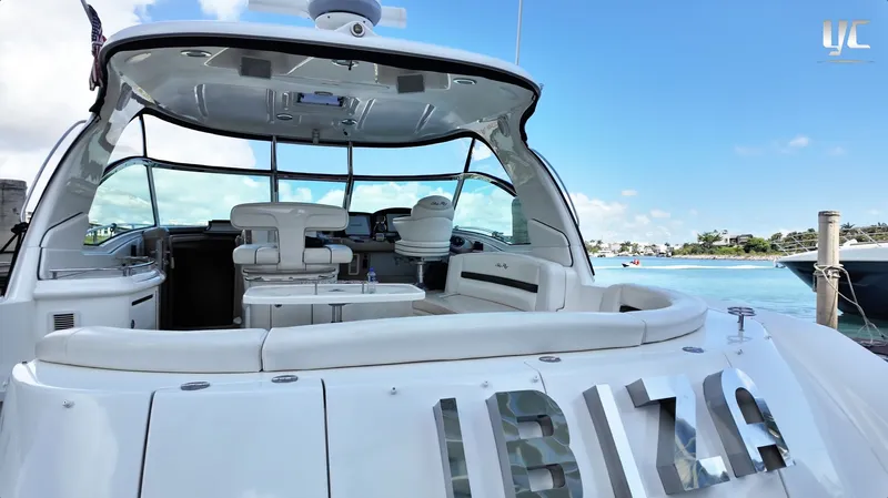  Yacht Photos Pics 2006 Sea Ray 52 Sundancer yacht docked, featuring spacious cockpit and luxurious seating.