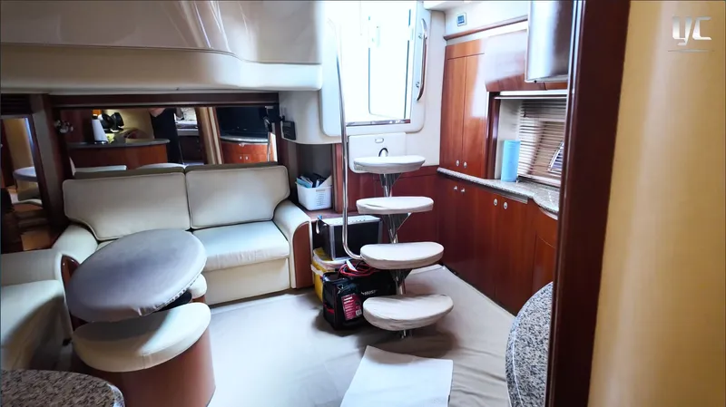  Yacht Photos Pics Luxurious interior of a 2006 Sea Ray 52 Sundancer yacht with elegant seating and cabinetry.