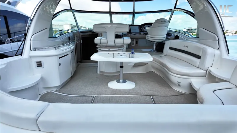  Yacht Photos Pics Luxurious interior of a 2006 Sea Ray 52 Sundancer yacht with elegant seating and helm.