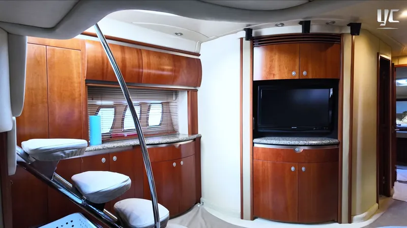  Yacht Photos Pics Luxurious interior of 2006 Sea Ray 52 Sundancer yacht with wood cabinetry and modern amenities.