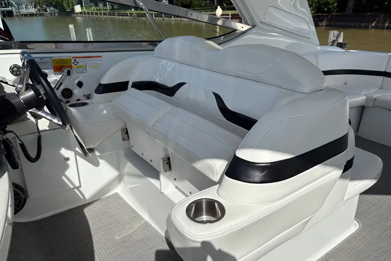  Yacht Photos Pics Interior of 2007 Formula 400 Super Sport boat with white seating and steering area.